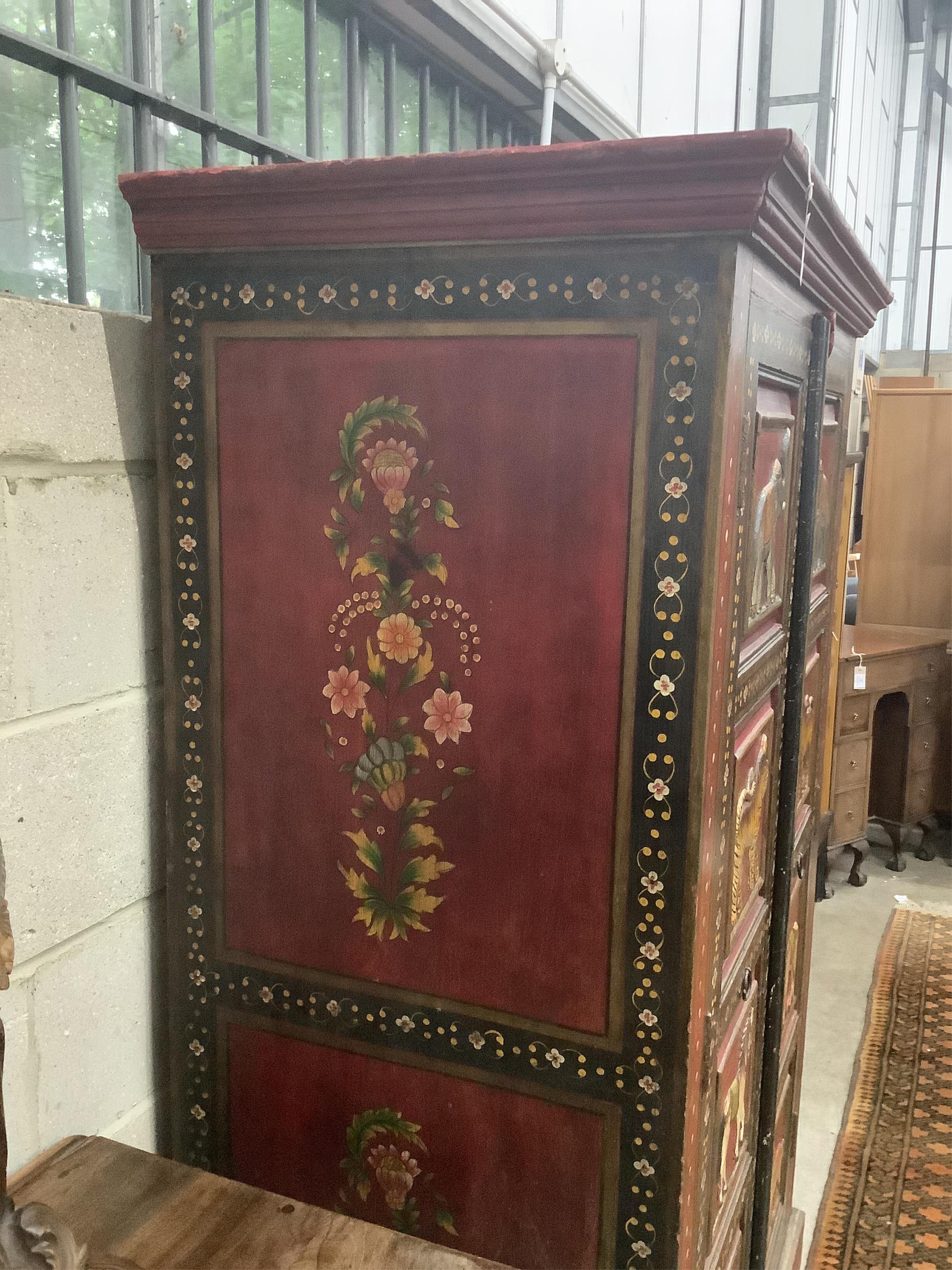 An Indian painted two door hall cupboard, width 100cm, depth 60cm, height 164cm. Condition - fair